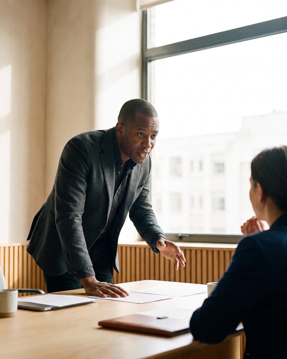 A senior CFO reviewing the work in a calm Frankfurt boardroom